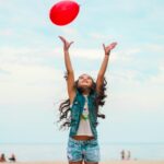 girl raising her hand